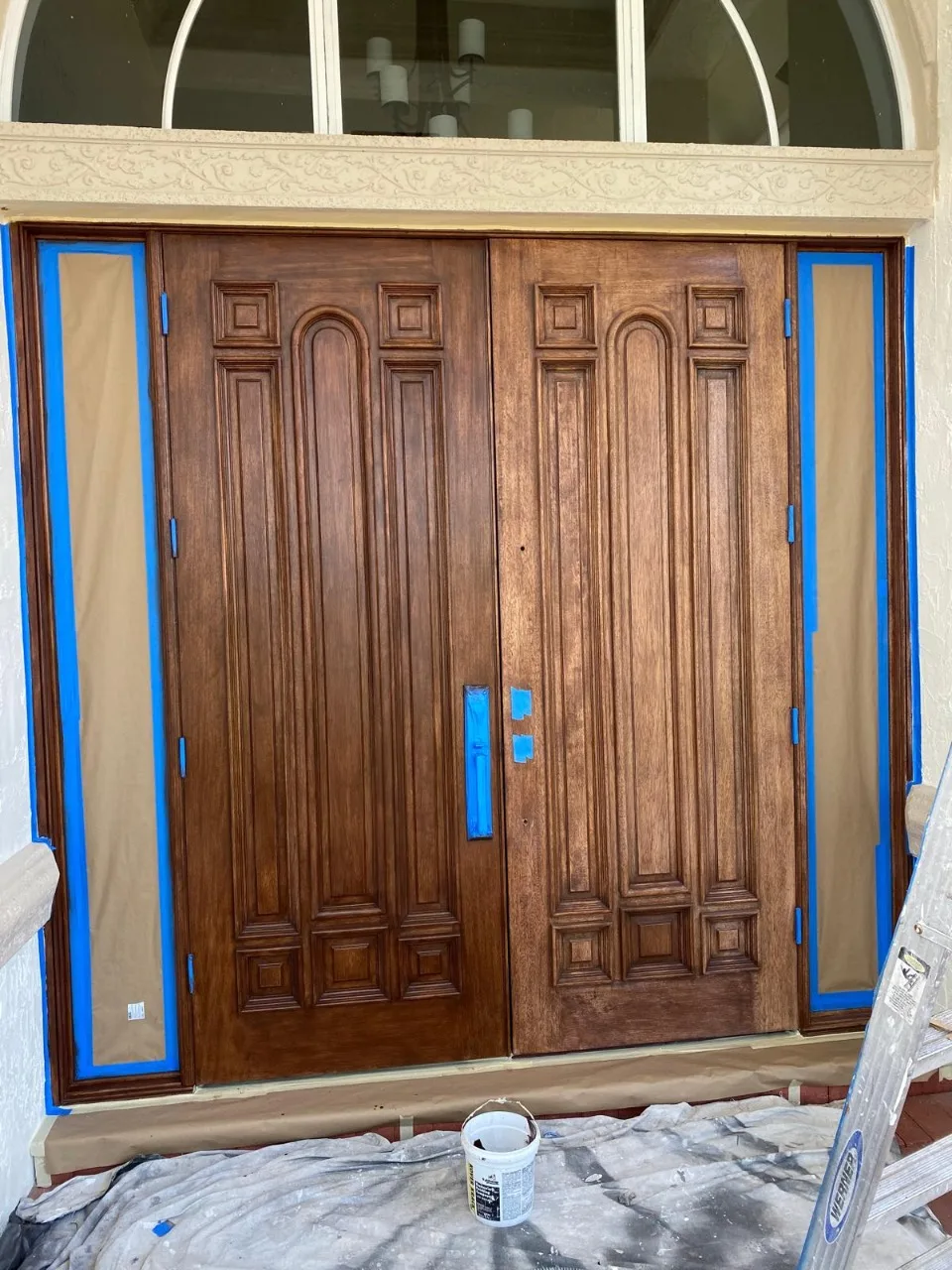 Strip off existing finish and starting fresh with one coat of stain a two of clear top coat.